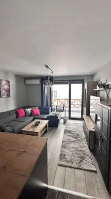 a living room with a couch and a table at Апартамент за гости Noa Sift in Velingrad