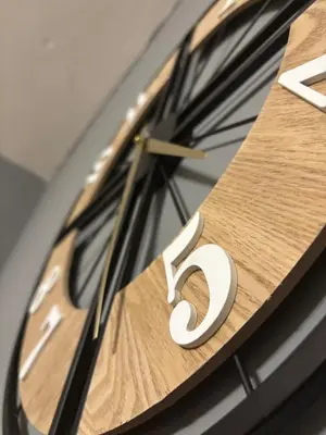 a clock with the number five on it at Vitoshкa Urban Stay in Sofia