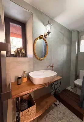 a bathroom with a sink and a mirror at Happy House Progled in Progled