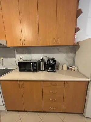 a kitchen counter with a microwave and a toaster at 2 Apartments 15 Seconds from Main street in Sofia