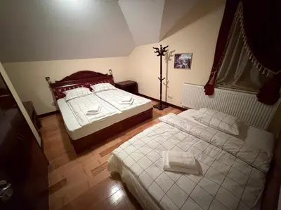 a bedroom with two beds in a room at Castle Inn Pamporovo 2 Bedroom Apartment in Pamporovo