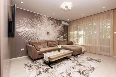 a living room with a couch and a table at South Beautiful Apartment Vaptsarov in Plovdiv
