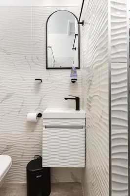 a bathroom with a sink and a mirror at Cozy Floor from a House Near the City Center by Flat Mаnager in Plovdiv