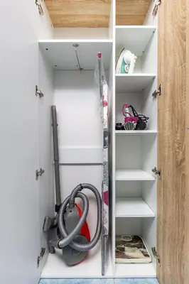 a walk in closet with a hose on the shelves at Cozy Floor from a House Near the City Center by Flat Mаnager in Plovdiv