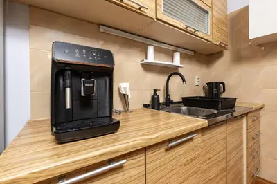 a kitchen with a coffee maker on a counter at Cozy Floor from a House Near the City Center by Flat Mаnager in Plovdiv