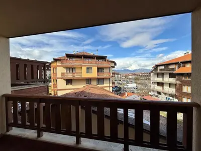 a view of a city from a balcony at Pirin Sense Apartment Home2Host in Bansko