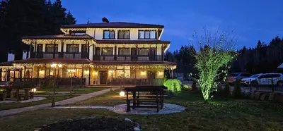 a large house is lit up at night at Свети Георги хотел и ресторант in Govedartsi