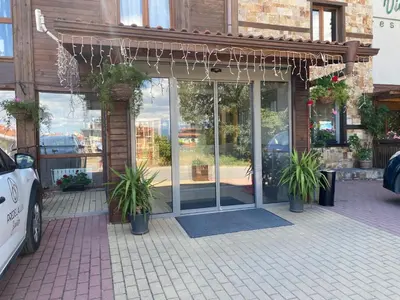 a store front with potted plants in front of it at The View Bansko in Bansko
