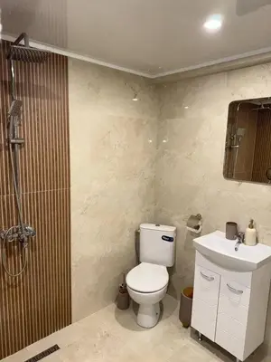 a bathroom with a toilet and a shower and a sink at Bianca Guest House Sapareva banya in Sapareva Banya