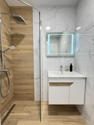 a bathroom with a white sink and a shower at Cusco Cozy Apt w Parking Spot near Paradise Mall and WiFI in Sofia