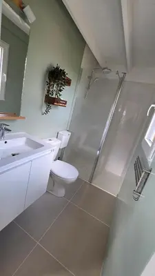a bathroom with a shower and a toilet and a sink at Cottage for 4 people 30 in Sofia