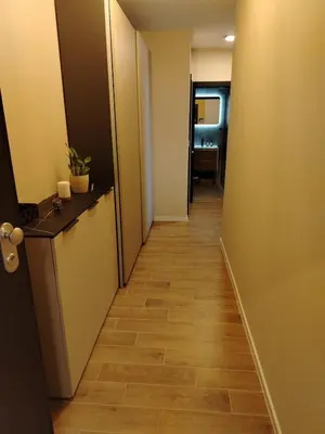 a corridor of an office with at AMur Deluxe Apartment in Sofia