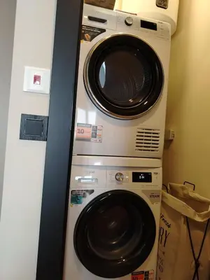 a washer and dryer in a room at AMur Deluxe Apartment in Sofia