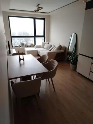 a living room with a couch and a table at AMur Deluxe Apartment in Sofia