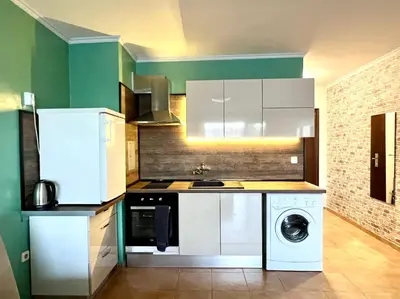 a kitchen with a washing machine and a washer at Flower home 2 in Sofia