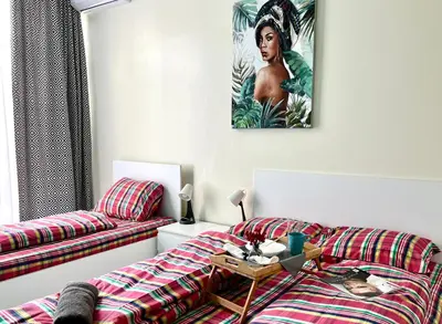 a living room with a couch and a table at Flower home 4 in Sofia