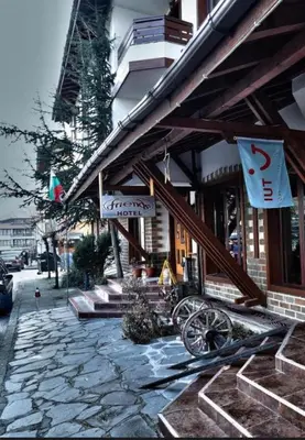 a building with signs on the side of it at Deluxe Apartment in Bansko