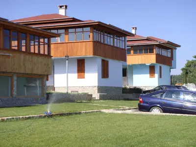 a house with a fire hydrant in the yard at Вилно селище Баташки хан in Tsigov Chark