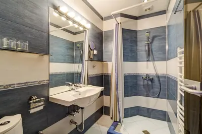a bathroom with a sink and a shower at Villa Kalia in Borovets