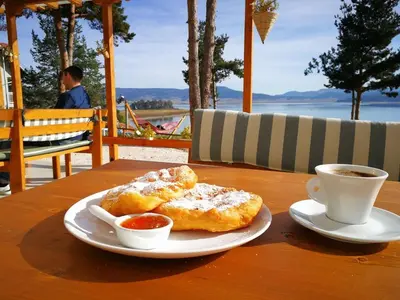 a table with two pastries and a cup of coffee at Villa Santa Maria in Tsigov Chark