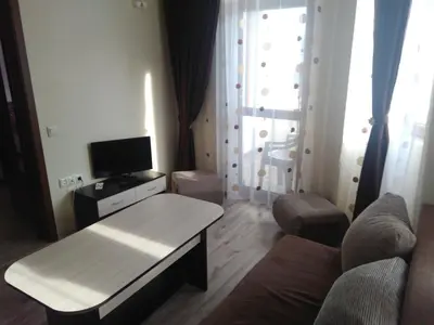 a living room with a couch and a table at Family Hotel Relaxa in Sapareva Banya