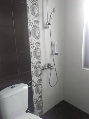 a shower stall with a toilet in a bathroom at Family Hotel Relaxa in Sapareva Banya