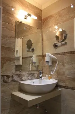 a bathroom with a sink and a mirror at Stoichkovata Kashta Koprivshtitsa in Koprivshtitsa