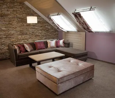 a living room with a couch and a table at Amira Boutique Hotel in Bansko