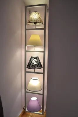 a shelf with three lamps on top of it at Guest House Secession Style in Sofia