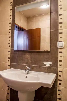 a bathroom with a sink and a mirror at Apartment Elegant in Velingrad