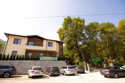 a group of cars parked in a parking lot in front of a building at Eco Hotel Momata in Kolarovo