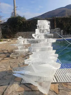a group of ice stairs next to a swimming pool at Holiday House Kubrat in Sapareva Banya