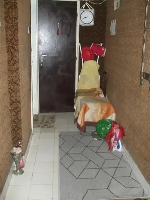 a hallway with a room with two beds and a door at Kamigs Rooms in Sofia