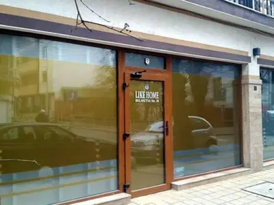 a store front with a sign on the door at Like Home Guest Rooms in Sofia