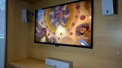 a flat screen tv hanging on a wall at Parkview Apartments in Sofia