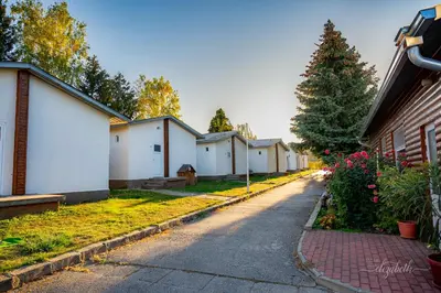 a row of white houses on a street at Camping Verila in Sapareva Banya