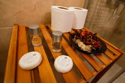 a table with a plate of food and toilet paper at Twin House in Ognyanovo