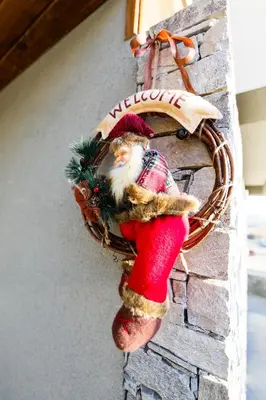 a santa claus ornament on a brick wall at Twin House in Ognyanovo