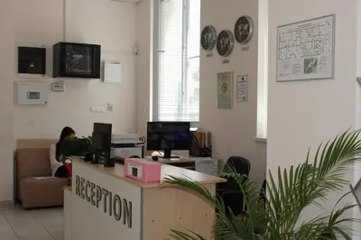 an office with a person sitting at a reception desk at Youth Centre Plovdiv in Plovdiv