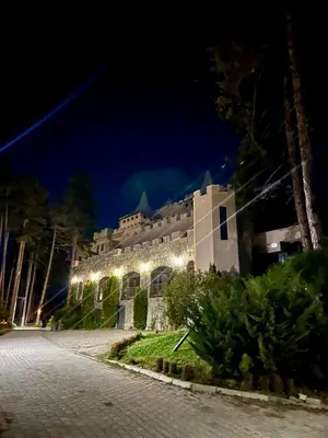 a building with lights on the side of a road at Valentina Castle in Ognyanovo
