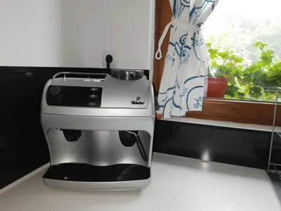 a coffee maker sitting on a counter next to a window at Boomerang Guest House in Apriltsi