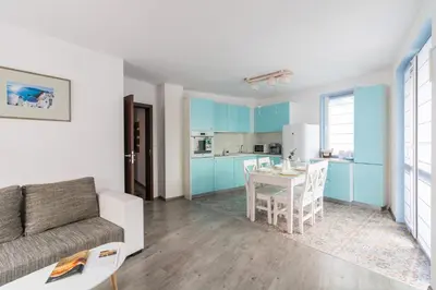 a living room with a couch and a table at Domus Apartments City Center with Parking in Plovdiv
