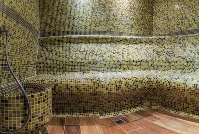 a tiled bathroom with a shower and a tub at Hotel Nikol in Dolna Banya