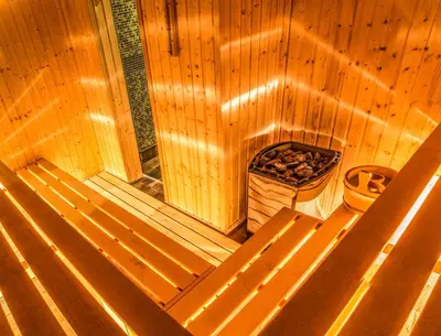 an overhead view of a sauna with a box of logs at Hotel Nikol in Dolna Banya