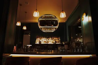 a bar with a lot of alcohol bottles at Boutique Guest House Coco in Plovdiv