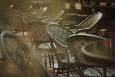 a group of chairs and tables in a restaurant at Boutique Guest House Coco in Plovdiv