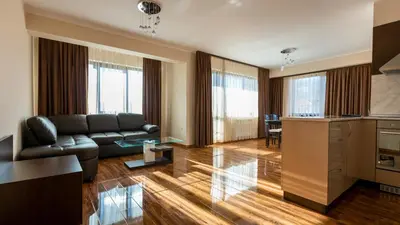 a living room with a couch and a table at Hotel Kristal in Dospat