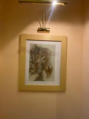 a picture of a man in a frame on a wall at hotel TEDI in Asenovgrad
