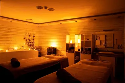 a hotel room with two beds and a kitchen at Zdravets SPA Hotel in Velingrad