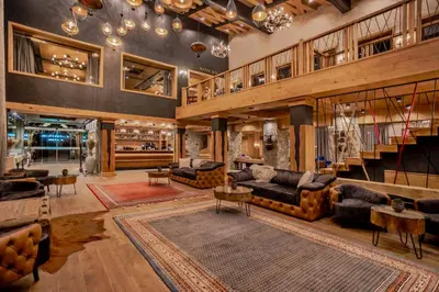 a large living room with couches and a staircase at Kashmir Wellness & SPA Hotel Adults Only in Velingrad